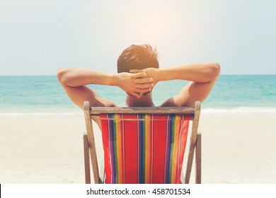 Man Relaxing On The Beach.Vintage Style.