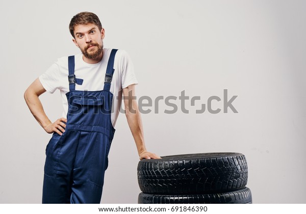 The man relies on the tire and wheel warehouse from\
the car