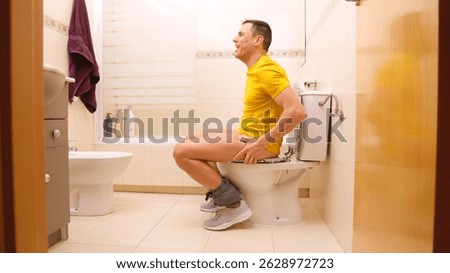 Man relieved after using toilet in bathroom