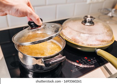 A Man Removes The Lid From The Pan - Spaghetti In Boiling Water - Home Cooking In Quarantine