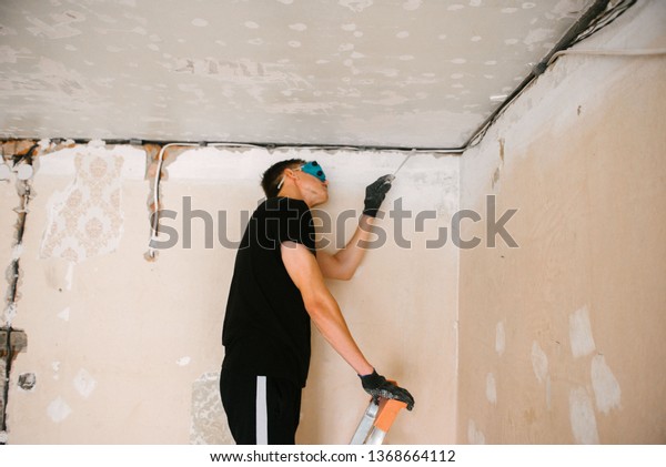 Man Removes Old Paint Ceiling Spatula Stock Photo Edit Now