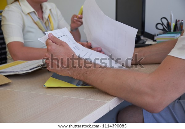 A man rents a car in the office, payment, car
selection, signing the
contract