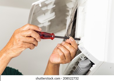 Man Repair Air Conditioner 