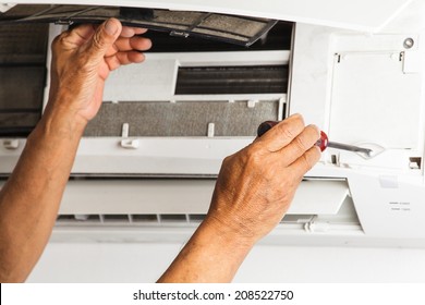 Man Repair Air Conditioner 