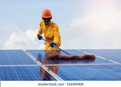A man Repair of solar cell.the concept of cleaning on solar panel.