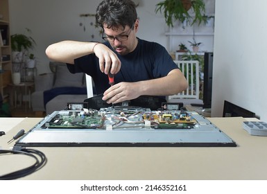 The Man Repairing Broken Tv 