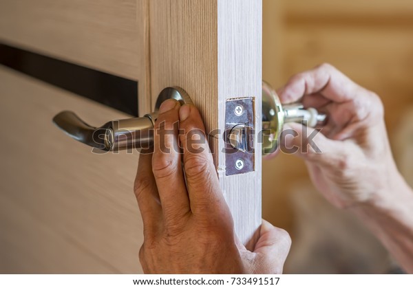 Man Repairing Doorknob Closeup Workers Hands Stock Photo Edit Now