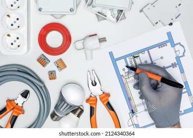  Man repairing electrical system in house or office. electrician checking electric scheme.