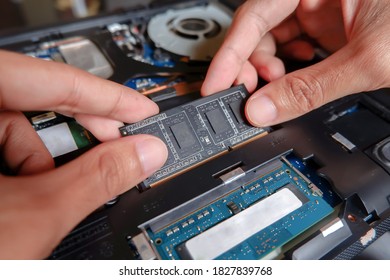 Man repairing laptop hardware. Work from home. - Shutterstock ID 1827839768