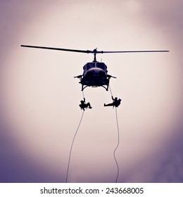 Man Rescue From Helicopter On Silhouette