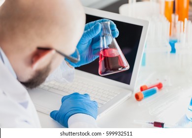 Man researcher carrying out scientific research. - Shutterstock ID 599932511