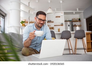 Man  Rest On Sofa Put Notebook On Lap Looking At Screen Watching Movie Enjoy Lazy Free Day, Creates Blog, Booking On-line, Buyer Choose Goods Makes Order, Shopping In Internet Lifestyle Concept