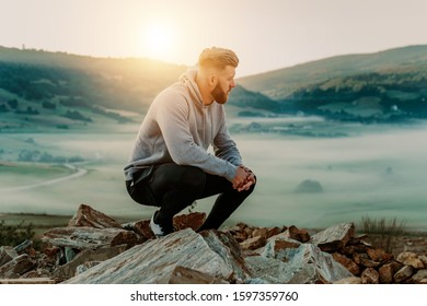 Man rest on top of mount after morning training - Shutterstock ID 1597359760