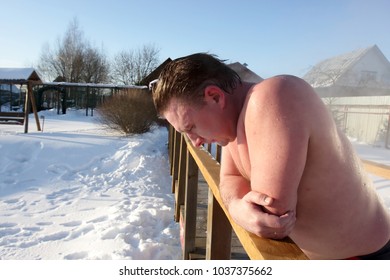 Man Resting After Sauna At Backyard In Winter