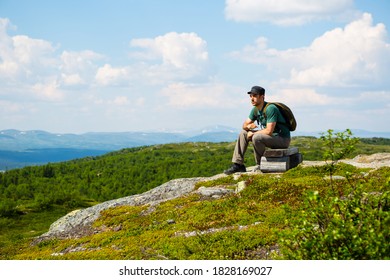 Man Resting And Looking Out In The Swedish Northern Nature During Summer.