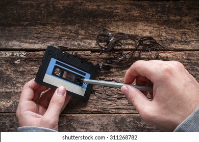 Man Rewind A Cassette Tape