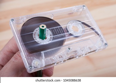 Man Rewind A Cassette Tape With A Pencil