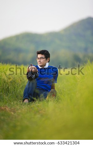 Similar – young man with hat in front of mountain panorama