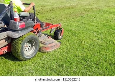 A Man Rides A Lawn Mower. Lawn Care. Riding Mower. Grass