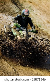 Man Riding ATV In Muddy Conditions