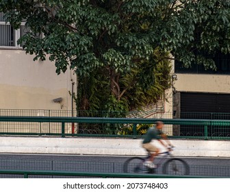 Man Riding A Bicycle With Slow Shutter Speed. 