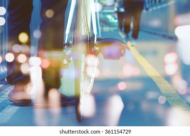 Man Riding Bike Double Exposure And Blurred View Of Car On Street At Night