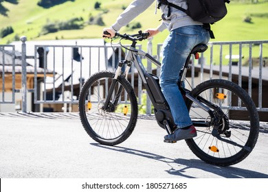 Man Riding E Bike Bicycle In City. Electric Bike In Summer