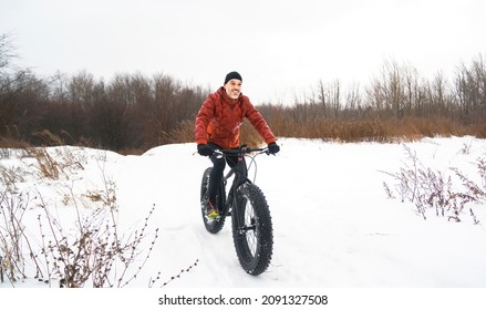 Man Riding A Fat Bike In Winter