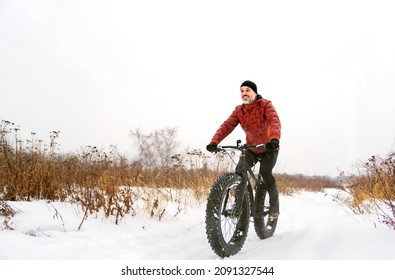 Man Riding A Fat Bike In Winter