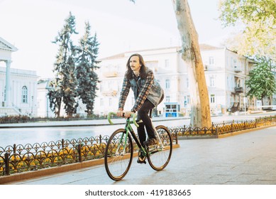 man riding fixed bike in city
