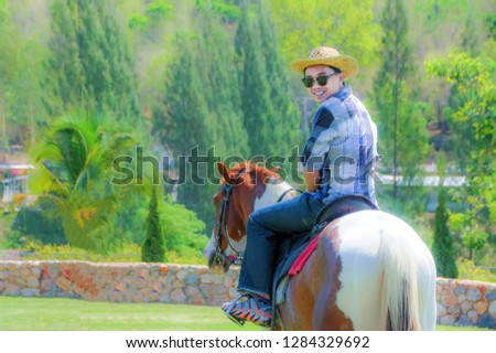 Man riding a horse.