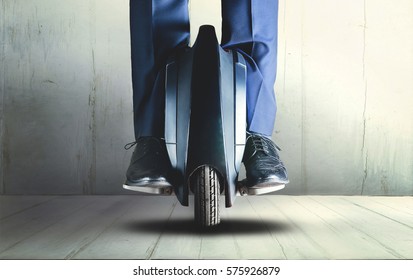 Man Riding Mono Wheel Electrical Transport