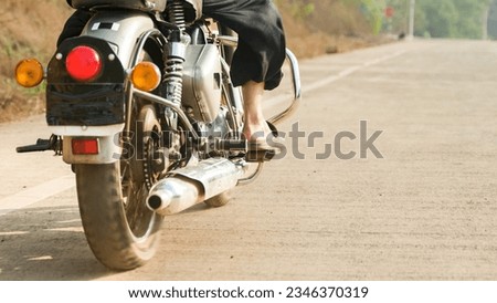 Similar – Image, Stock Photo Couple sitting over motorcycle ready to go