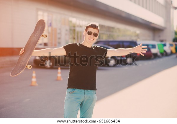 man\
riding a skateboard, walking park and a good\
time
