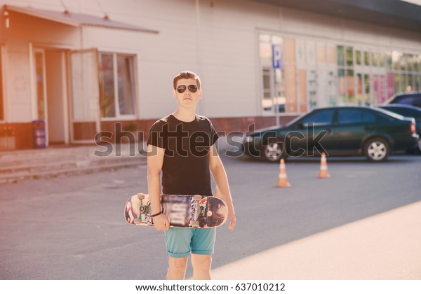 man\
riding a skateboard, walking park and a good\
time