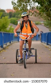 Man Riding Tricycle