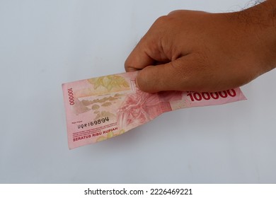 Man Right Hand Showing Indonesian Rupiah Money