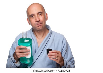 Man Rinsing With Mouthwash