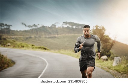 Man, road running and space in nature for exercise mockup, wellness or music with commitment for health. African male runner, listening and audio for focus, mindset and mock up with workout on street - Powered by Shutterstock