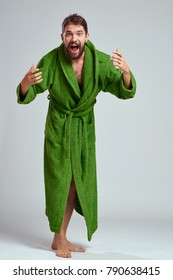 a man in a robe on a gray background                               