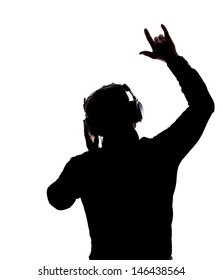 Man rocking on with headphones in silhouette isolated over white background 