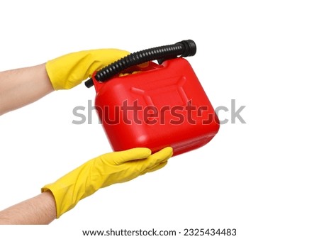 Man in rubber gloves holding red canister on white background, closeup