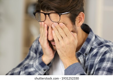 Man Rubbing His Tired Eyes
