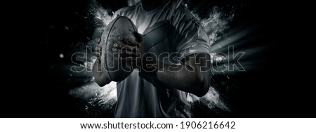 Man rugby player holds ball. Sports banner. Horizontal copy space background