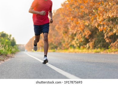 Man Runner Athlete On The Road To Healthy, Young People Running Exercise On Street.