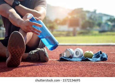 Man Runner Is Holding Bottle Of Water.