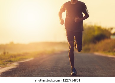 The Man With Runner On The Street Be Running For Exercise.