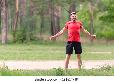 Man runner training. Male athlete stretching muscles at the park. Healthy, fitness, wellness lifestyle. Sport, cardio, workout concept