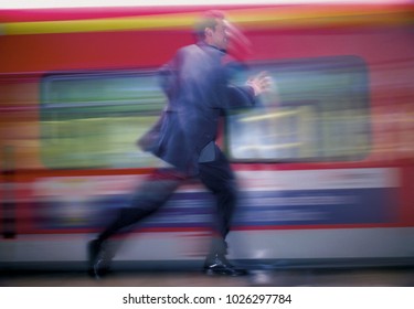 Man Running After Train