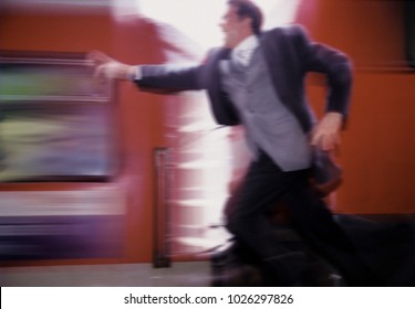 Man Running After Train